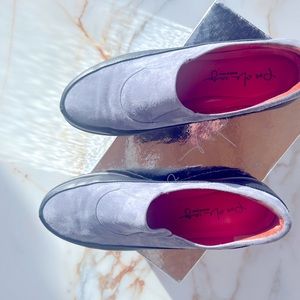 Suede with black trim and leather bottoms. Durable black rubber soles.